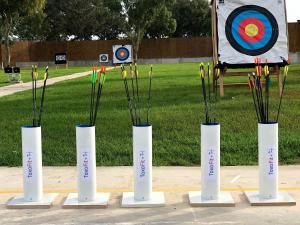 a group of three vases with arrows and a target at PylaApts - Apartments near the beach in Pyla