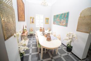 a dining room with a table and chairs at Casa Xanadu Seville - 6 bedroom Andalusian home with terraces in Seville