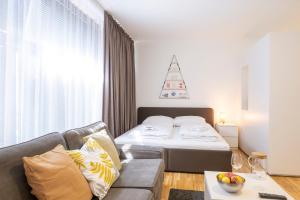 Säng eller sängar i ett rum på Modern City Hideaway Graz