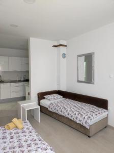 Una cama o camas en una habitación de Apartman Markešić 3