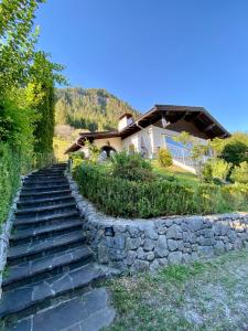 a house with a stone staircase in front of a house at Ferienhaus Sonnleiten in Walchsee