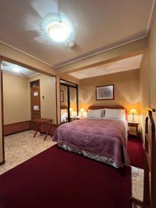 Postel nebo postele na pokoji v ubytování Hotel Mosul + 13 fotografií