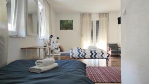 a room with a bed with towels on it at Aria Plitvice in Plitvička Jezera