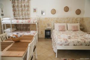 Giường trong phòng chung tại ALLA CORTE DEGLI ALBEROLUNGO