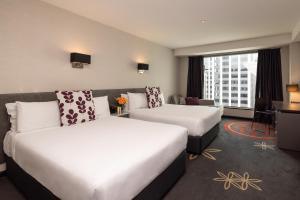 Posteľ alebo postele v izbe v ubytovaní SkyCity Hotel Auckland