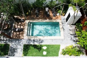 an overhead view of a swimming pool in a backyard at Lumina at Looltum Tulum in Tulum