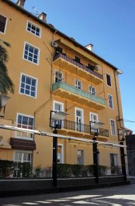 a yellow building with balconies on the side of it at Apartments with WiFi Split - 4856 in Split