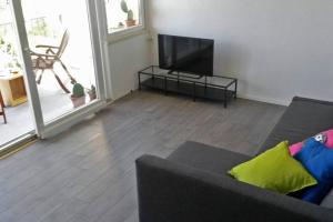 a living room with a couch and a flat screen tv at Apartments by the sea Sobra, Mljet - 4936 in Babino Polje