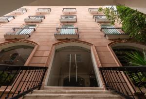 a building with balconies on the side of it at Sendero Hotel in Actopan