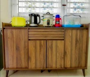 a wooden counter with appliances on top of it at Desaru M'Cozy,12pax,Waterpark,BBQ,WIFI in Bandar Penawar +32 photos