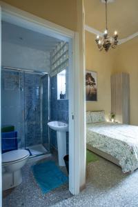 a bedroom with a bed and a shower and a sink at Florence Urban Nest ~ Guesthouse in Florence