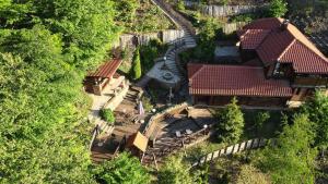 an overhead view of a house with a yard at Zlatibor Vila Janjić in Zlatibor