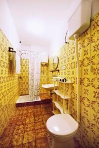a bathroom with a toilet and a sink and a shower at Apartments and rooms with parking space Komiza, Vis - 8844 in Komiža +39 photos