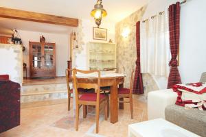 a living room with a table and a couch at Apartments with a parking space Rukavac, Vis - 8859 in Vis +19 photos