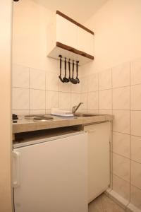 a kitchen with a sink and a counter top at Studio Rukavac 8863a in Rukavac