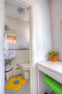 a bathroom with a toilet and a sink at Apartments by the sea Rogac, Solta - 11220 in Rogač