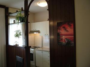 a kitchen with a refrigerator and a stove top oven at Apartments with WiFi Split - 11312 in Split