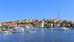 a group of boats are docked in a harbor at Apartments by the sea Seget Vranjica, Trogir - 12915 in Trogir