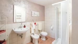 a bathroom with a toilet and a sink at A Casa di Anna in Cortemilia +20 photos