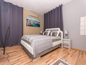 Ein Bett oder Betten in einem Zimmer der Unterkunft Villa Stil