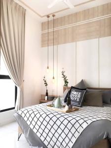 a bedroom with a bed and a window at Pavilion Premier Suite Puchong - 6-7pax 3R2B in Puchong