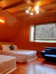 En eller flere senger på et rom på Haowangjiao Homestay