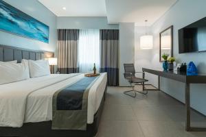 Voodi või voodid majutusasutuse Bayfront Hotel Cebu North Reclamation toas