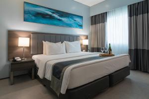 Voodi või voodid majutusasutuse Bayfront Hotel Cebu North Reclamation toas