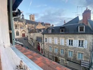 a view of a city from a window at Le doyenne in Nevers