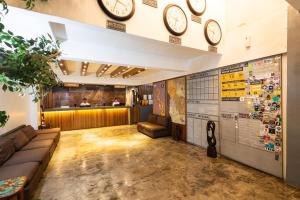 a waiting room with clocks on the wall at Z Hostel in Manila