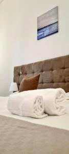 A bed or beds in a room at Home De Curtis