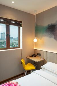 Postel nebo postele na pokoji v ubytování Ginger Mumbai, Goregaon