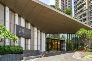 an external view of the entrance to a building at CM Serviced Apartment in Shenzhen