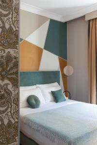 Un ou plusieurs lits dans un hébergement de l'établissement Boutique Hotel Galatea