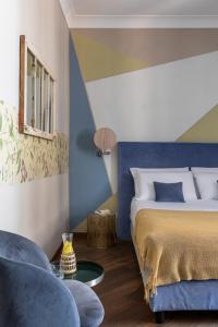 Un ou plusieurs lits dans un hébergement de l'établissement Boutique Hotel Galatea