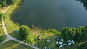 an aerial view of a group of campsites next to a lake at Domek SADKOWO - wśród jabłoni , balia ogrodowa dodatkowo płatna in Pollnow