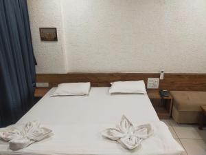 Hotel Kartiki客房内的一张或多张床位