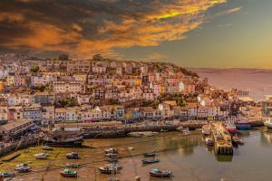 a view of a town with boats in the water at The Captain's Cottage, Brixham in Brixham