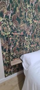 A bed or beds in a room at Casita del Río Ourense