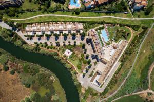 an aerial view of a resort complex next to a river at Laguna - Vilamoura in Vilamoura