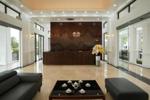 a living room with a couch and a table at DAD Resort Phú Quốc in Phú Quốc +37 photos