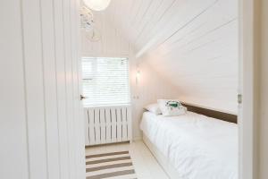 Tempat tidur dalam kamar di Jonkerstee 216 - Ouddorp - NOT FOR COMPANIES
