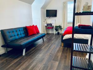 a living room with a couch and a bunk bed at The Loft @ Denver in East Maitland