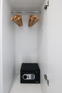 a room with a radio in a white wall at Phaedrus Living - Seaside Luxury Flat Harbour 103 in Paphos