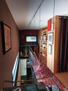 a room with a staircase with a glass wall at Holiday Home Hisa Gusta in Most na Soči