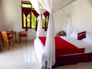 Ένα ή περισσότερα κρεβάτια σε δωμάτιο στο Bali Oase Resort