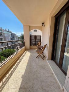 a balcony with a chair and a view at Bonito Apartamento en el Centro de Moraira in Moraira