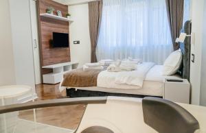 Krevet ili kreveti u jedinici u objektu 9 Nine - Luxury Apartments & Suites