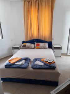 Postel nebo postele na pokoji v ubytování Apartmani Jacimovic