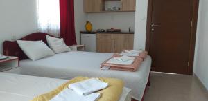 Postel nebo postele na pokoji v ubytování Apartmani Jacimovic